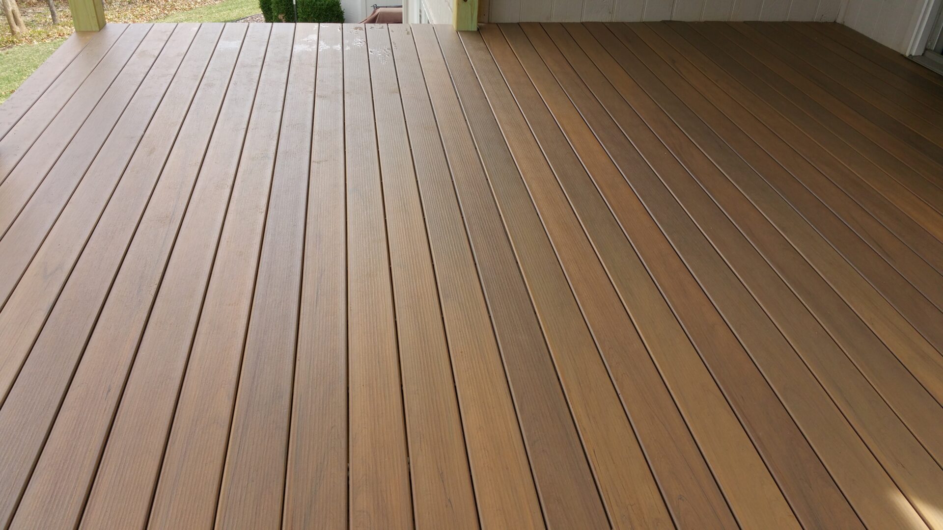 Smooth wooden floor with long, parallel planks.