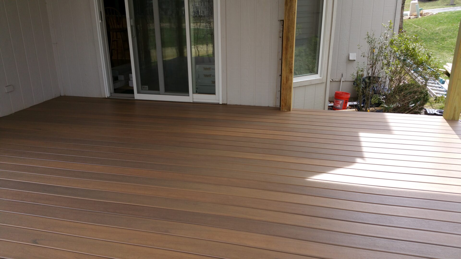 Spacious wooden deck with clean lines and natural light.