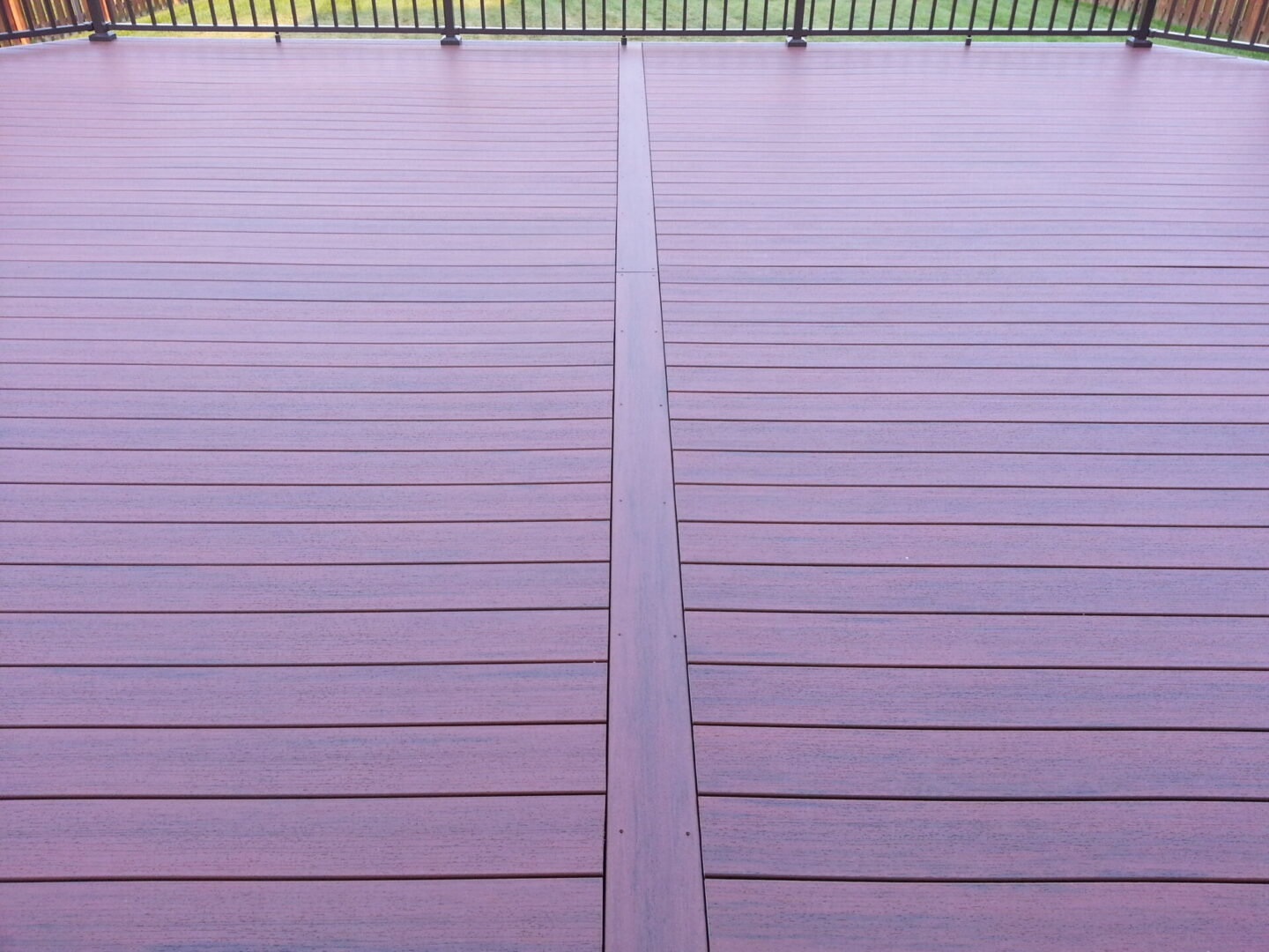 Close-up of a wooden deck with a central dividing line.