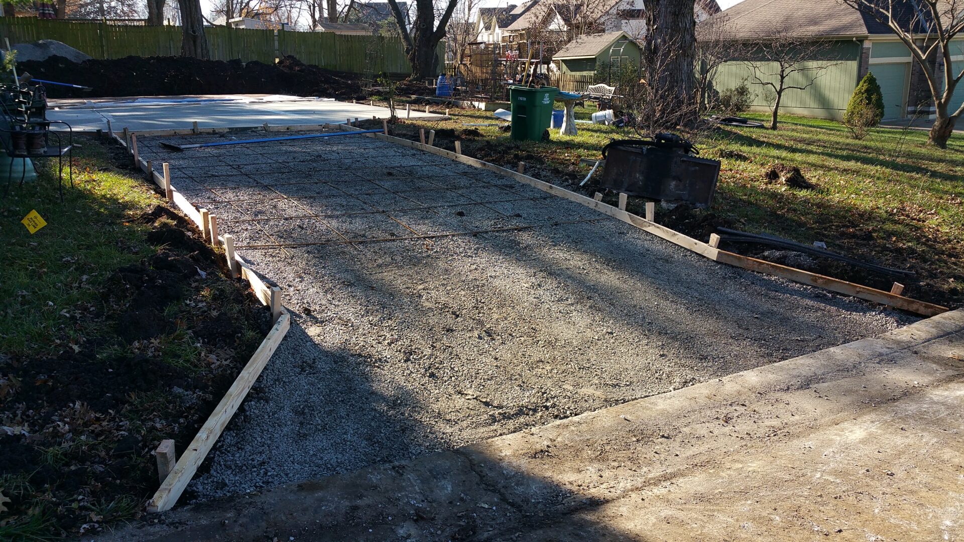 Freshly poured concrete on a driveway under construction.