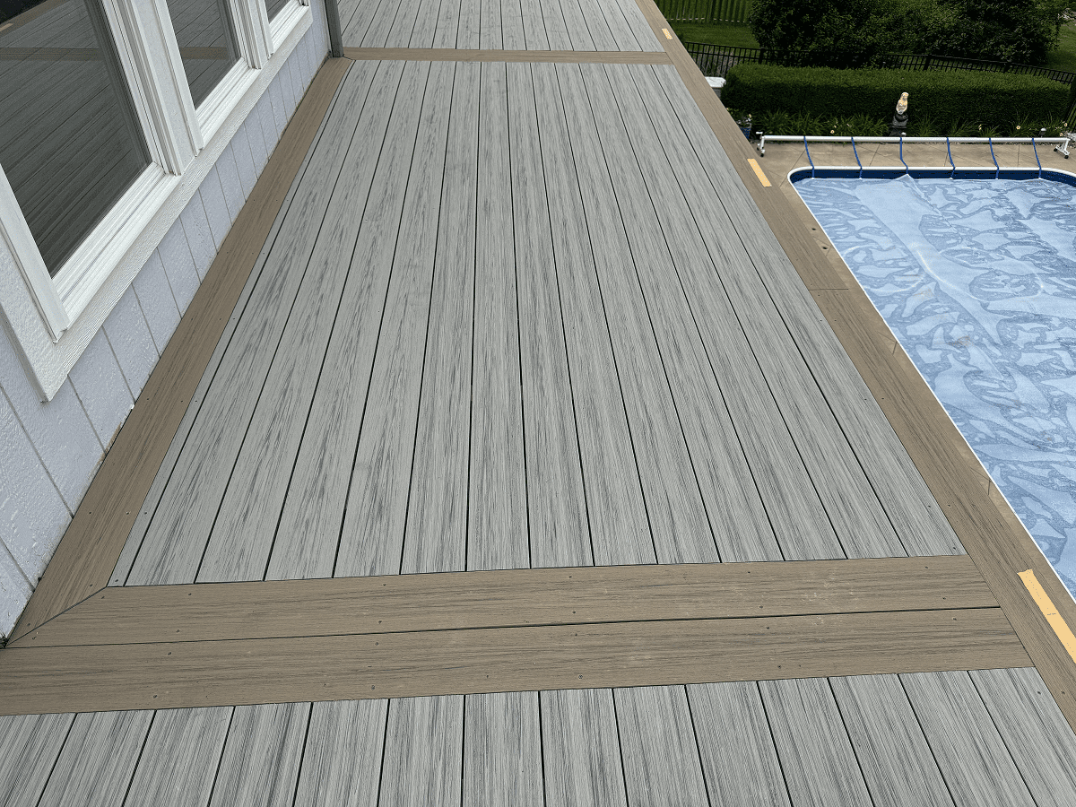 Wooden deck with a pool view and a transition strip.
