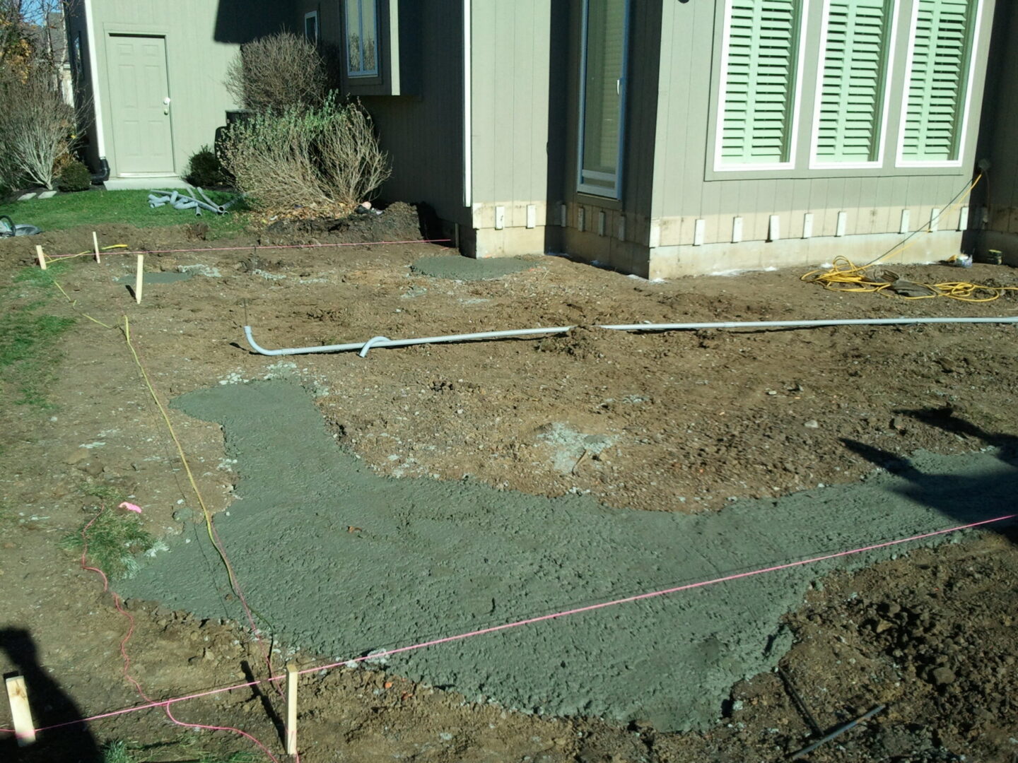 House exterior with freshly poured concrete