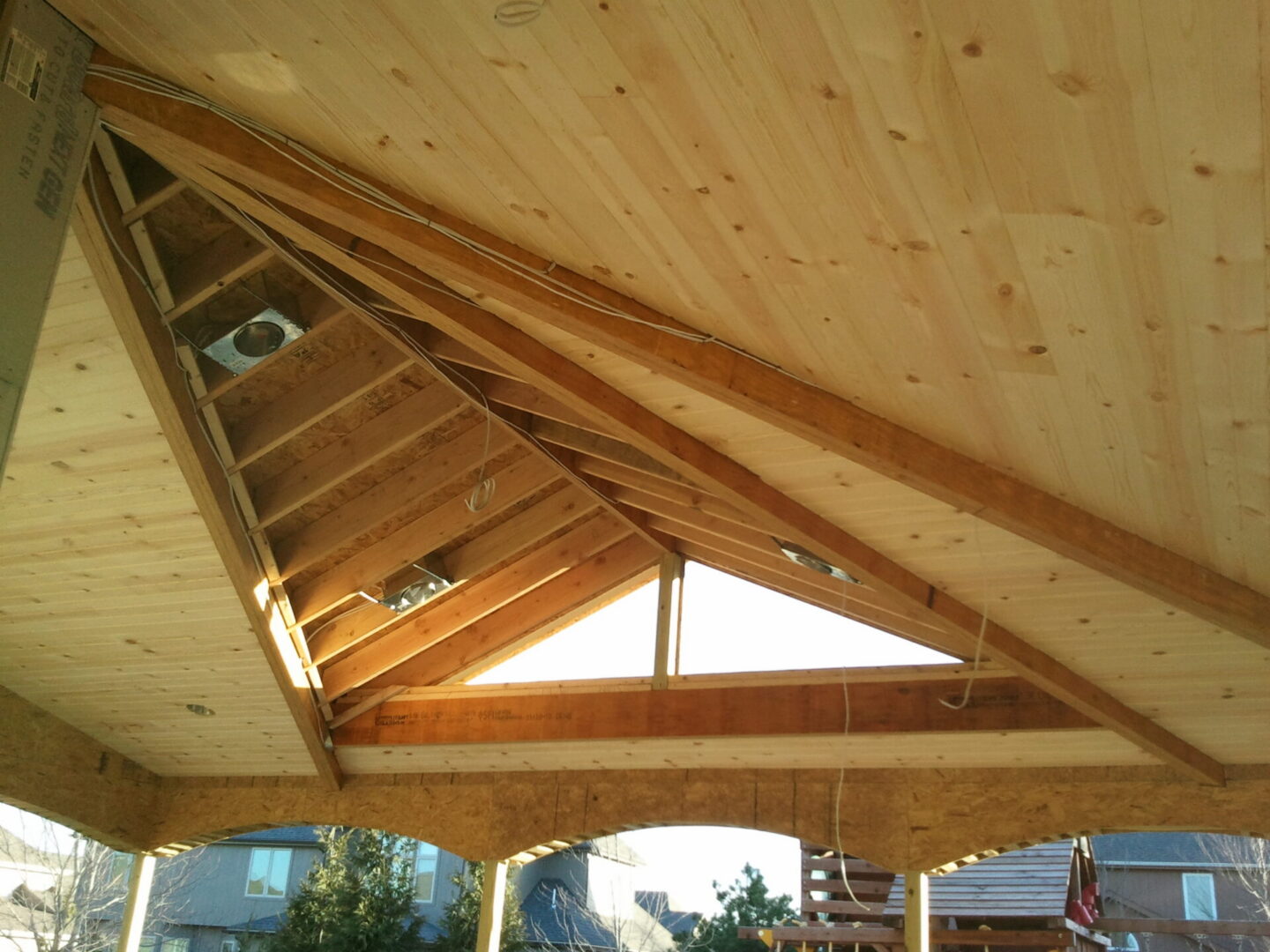 Vaulted wooden ceiling with triangular window