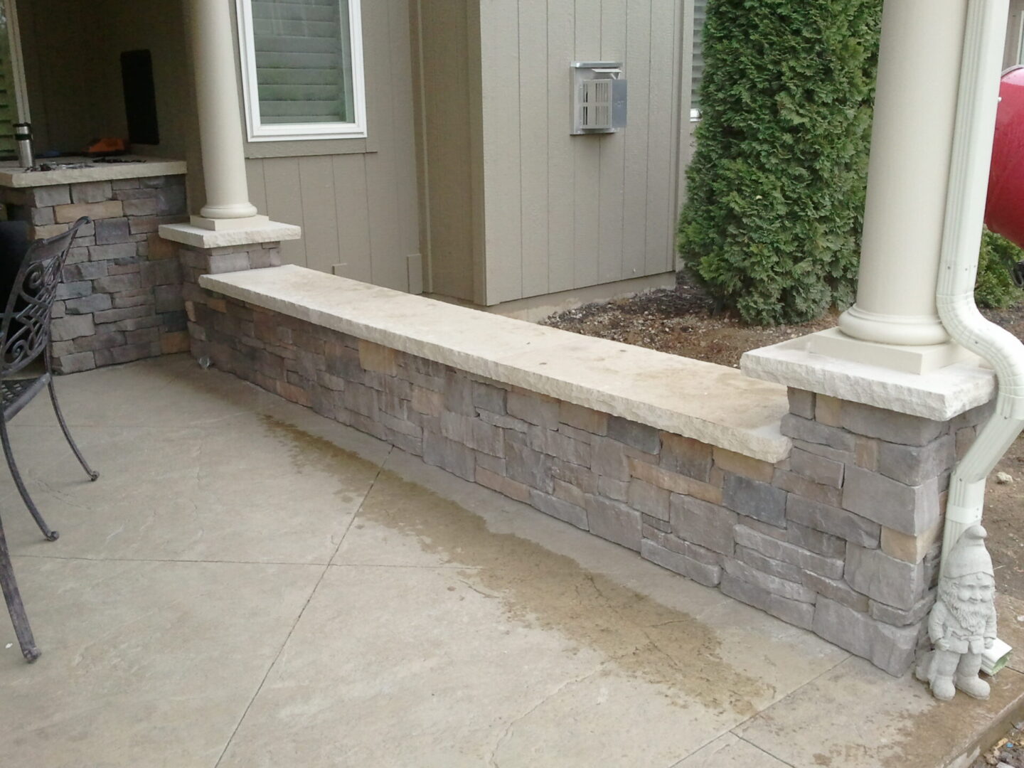 Stone porch bench wall with columns