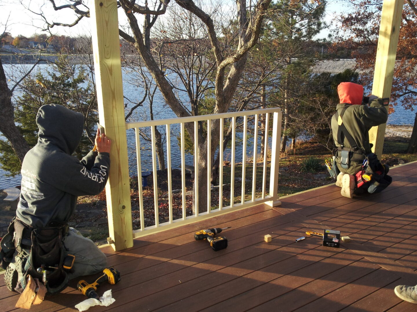 Outdoor deck railing installation by lake