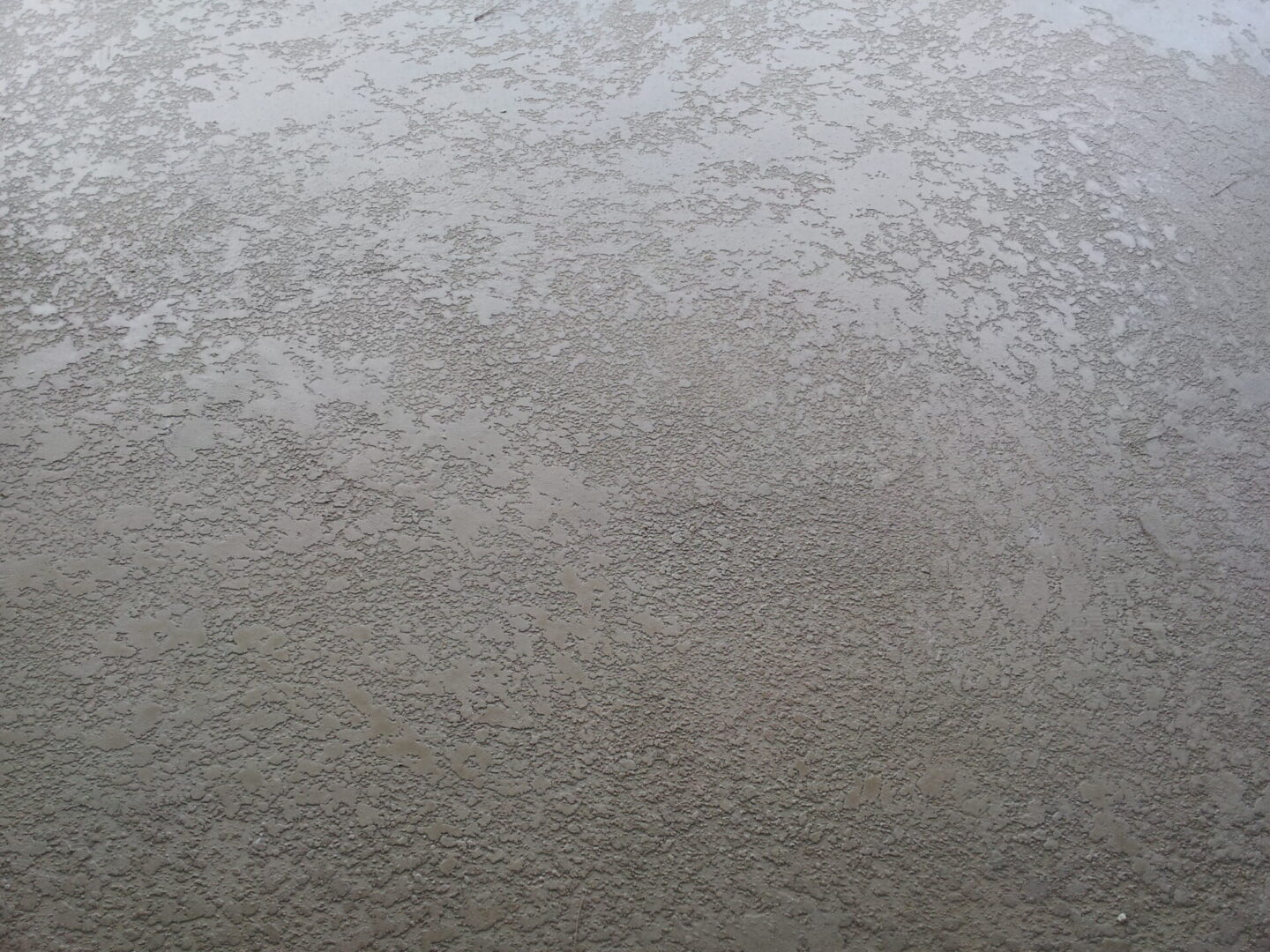 Gray textured stucco wall surface