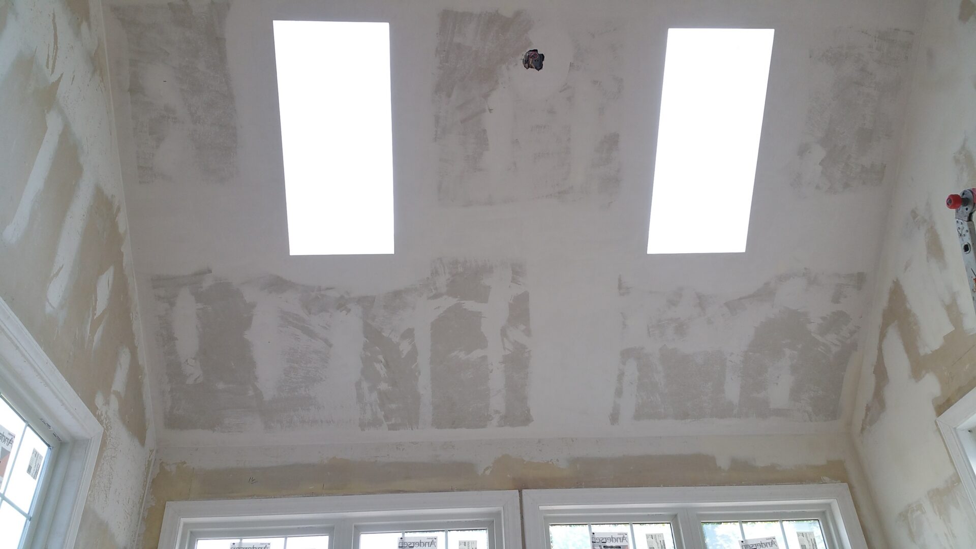 Room ceiling under construction with two skylights