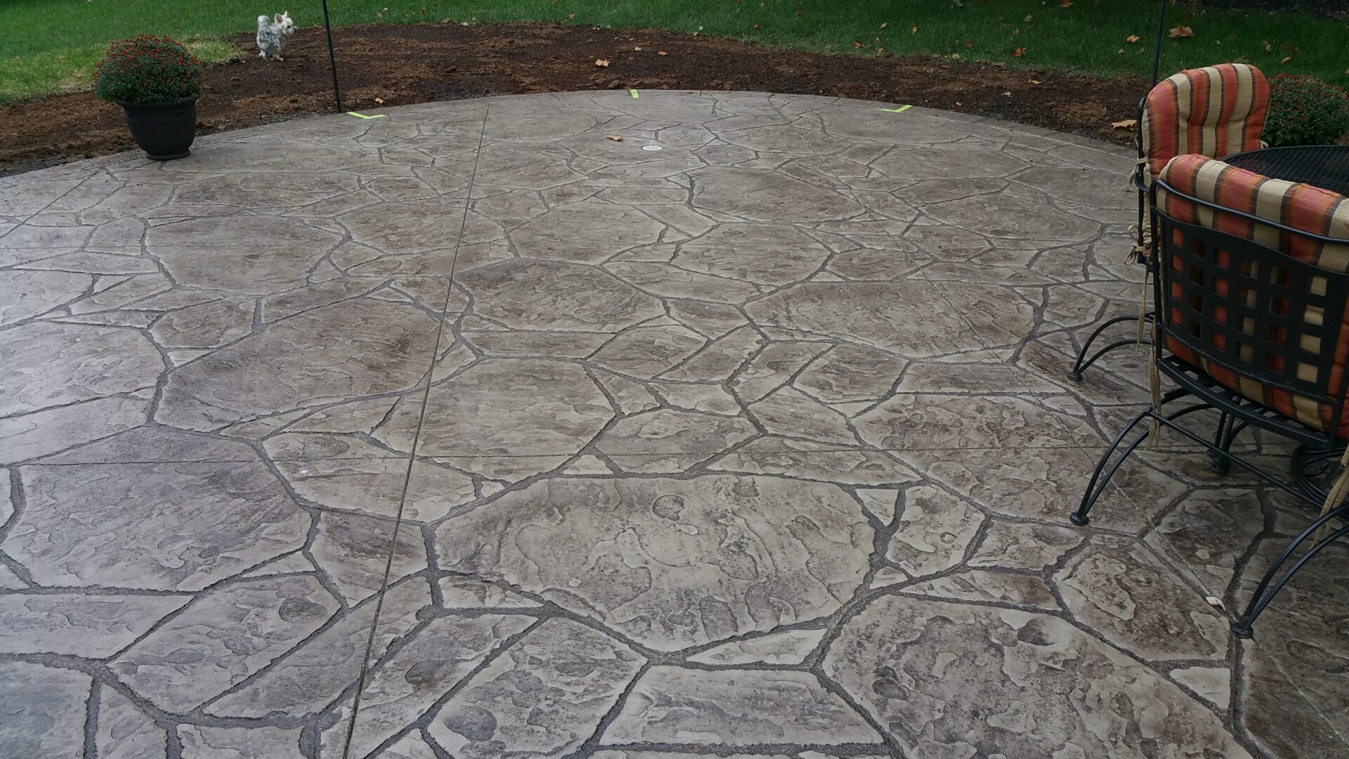 Stamped concrete patio with outdoor chairs