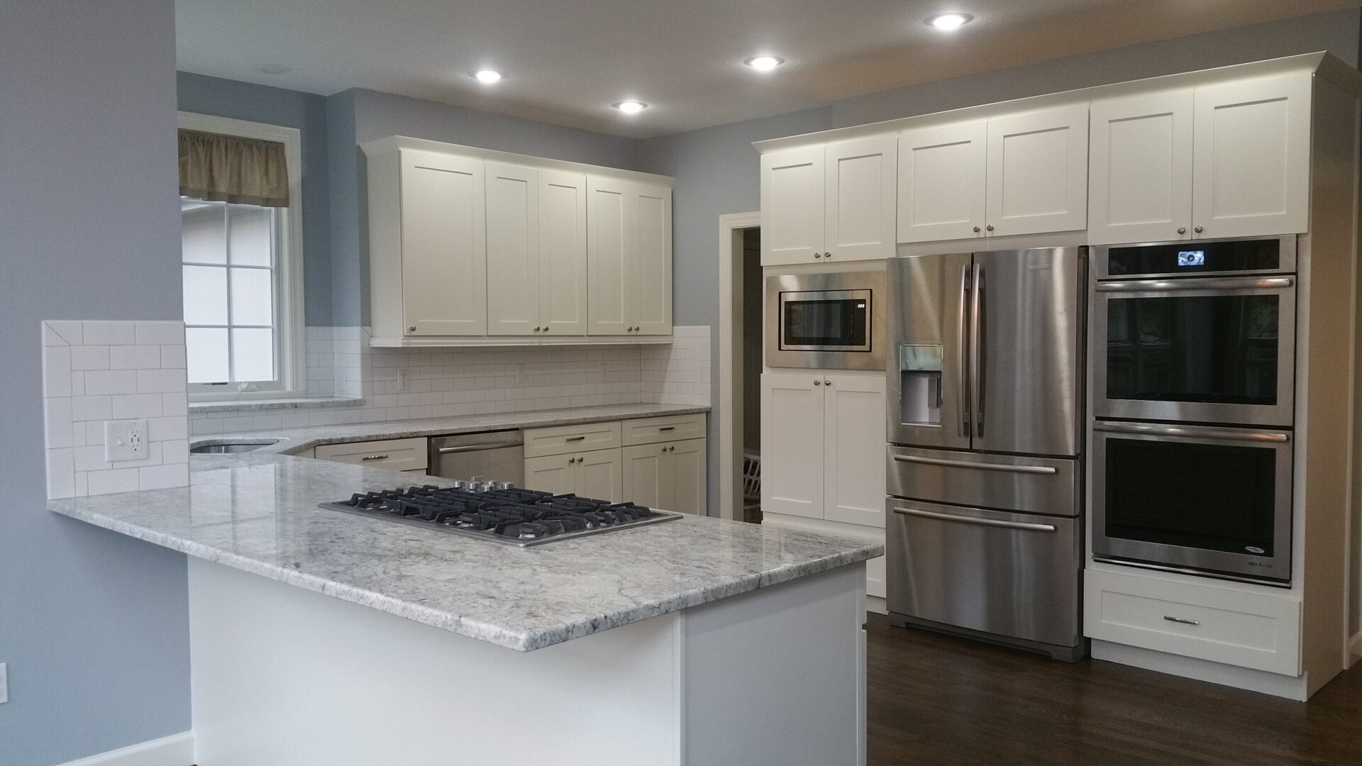 Modern kitchen with island and stainless appliances