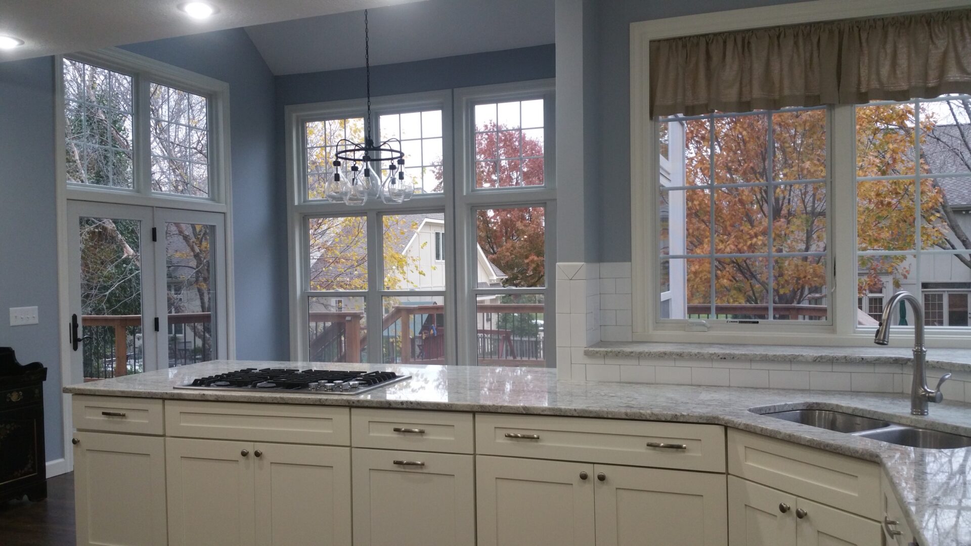Bright kitchen with island and large windows