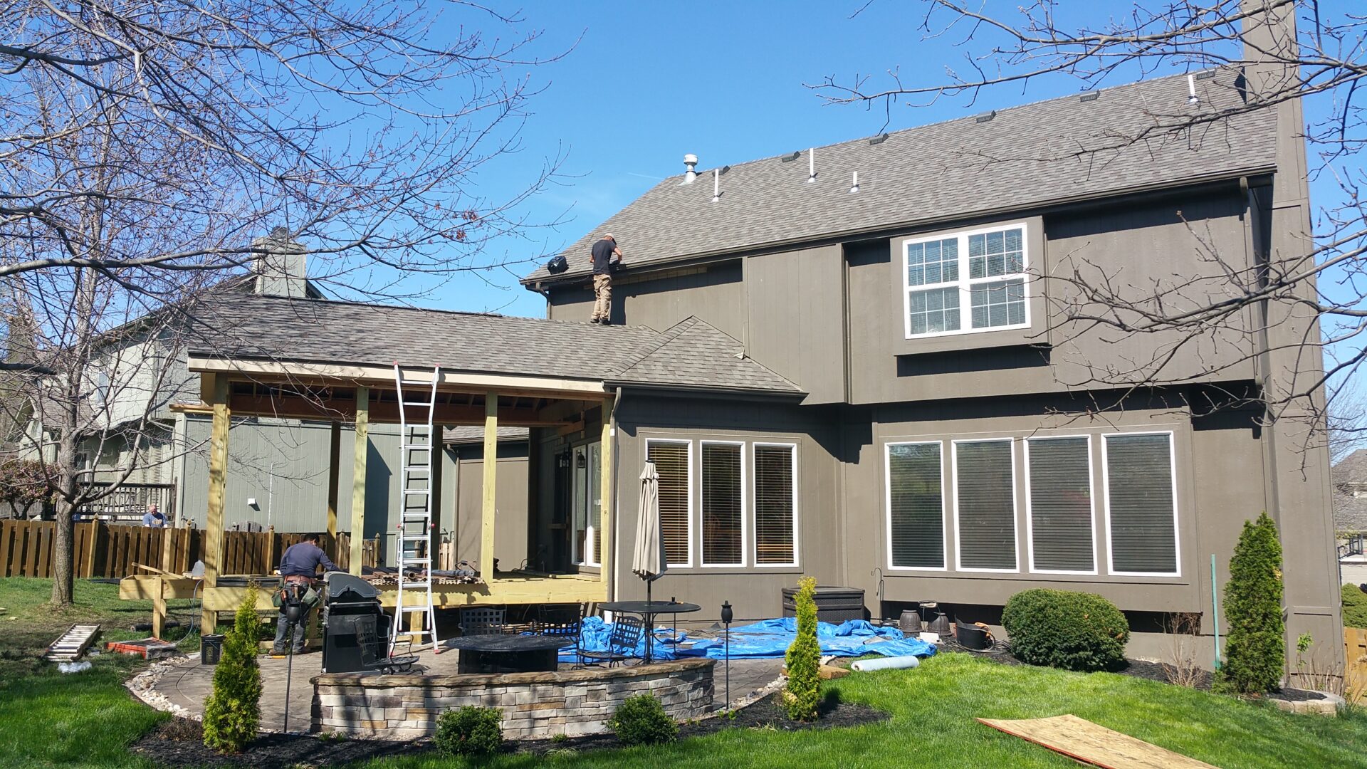 Two-story house with backyard deck under construction