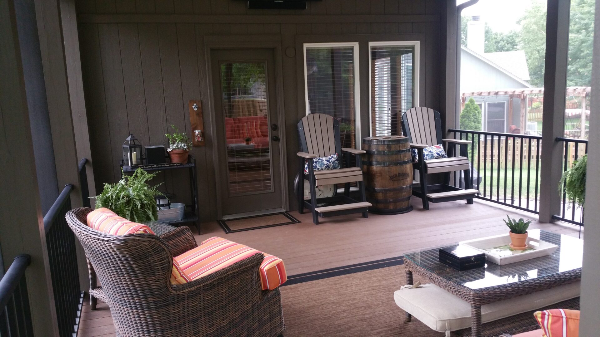 Cozy covered porch with wicker furniture