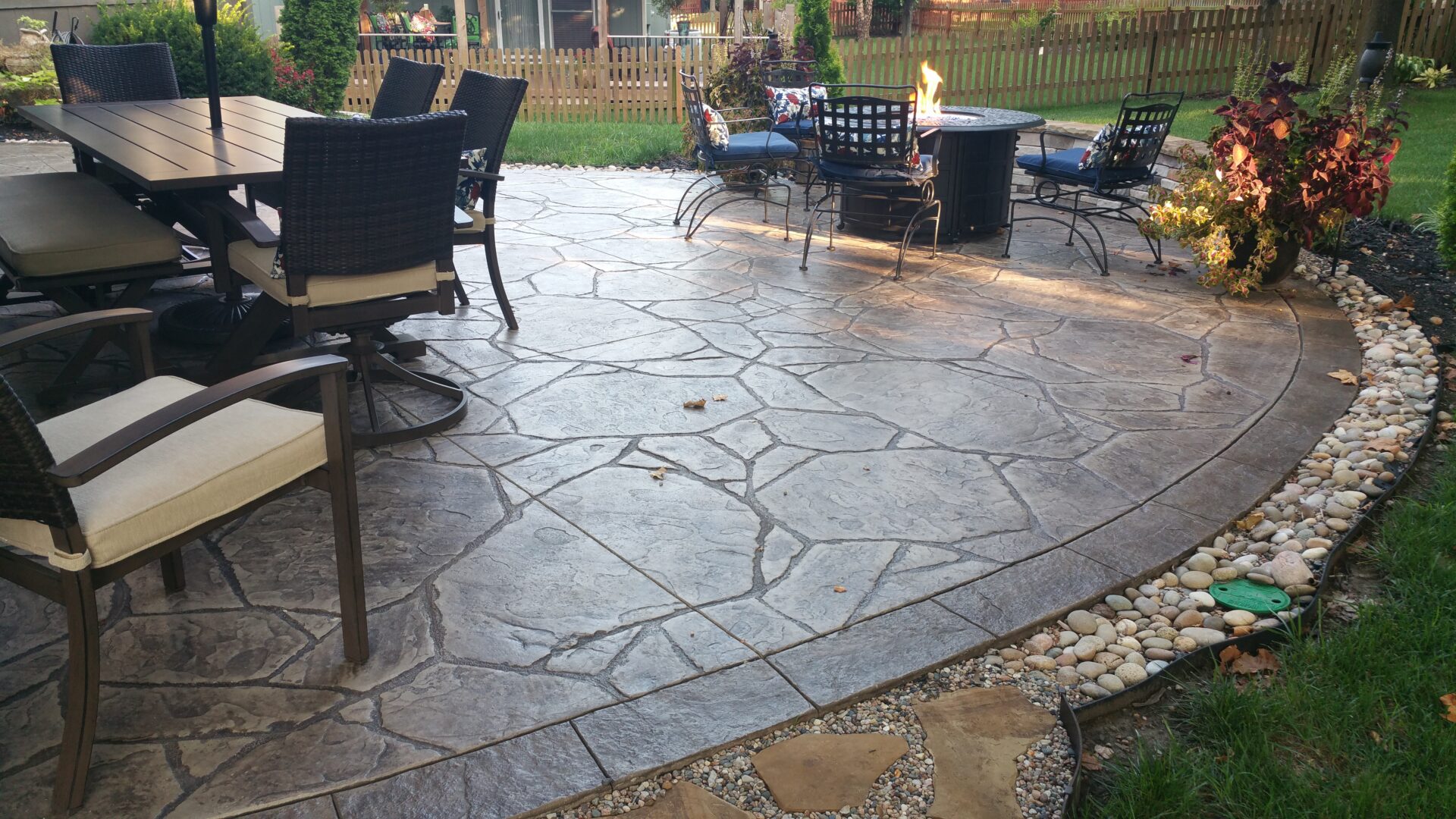 Outdoor stamped concrete patio with dining furniture