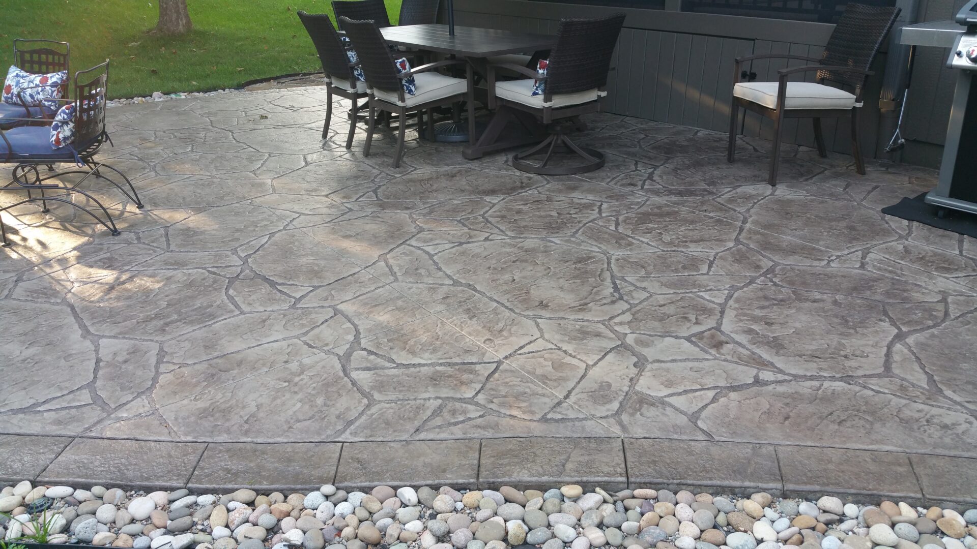 Stamped concrete patio with outdoor dining set