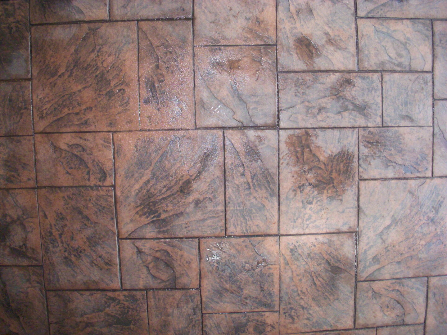 Brown textured square tile floor pattern