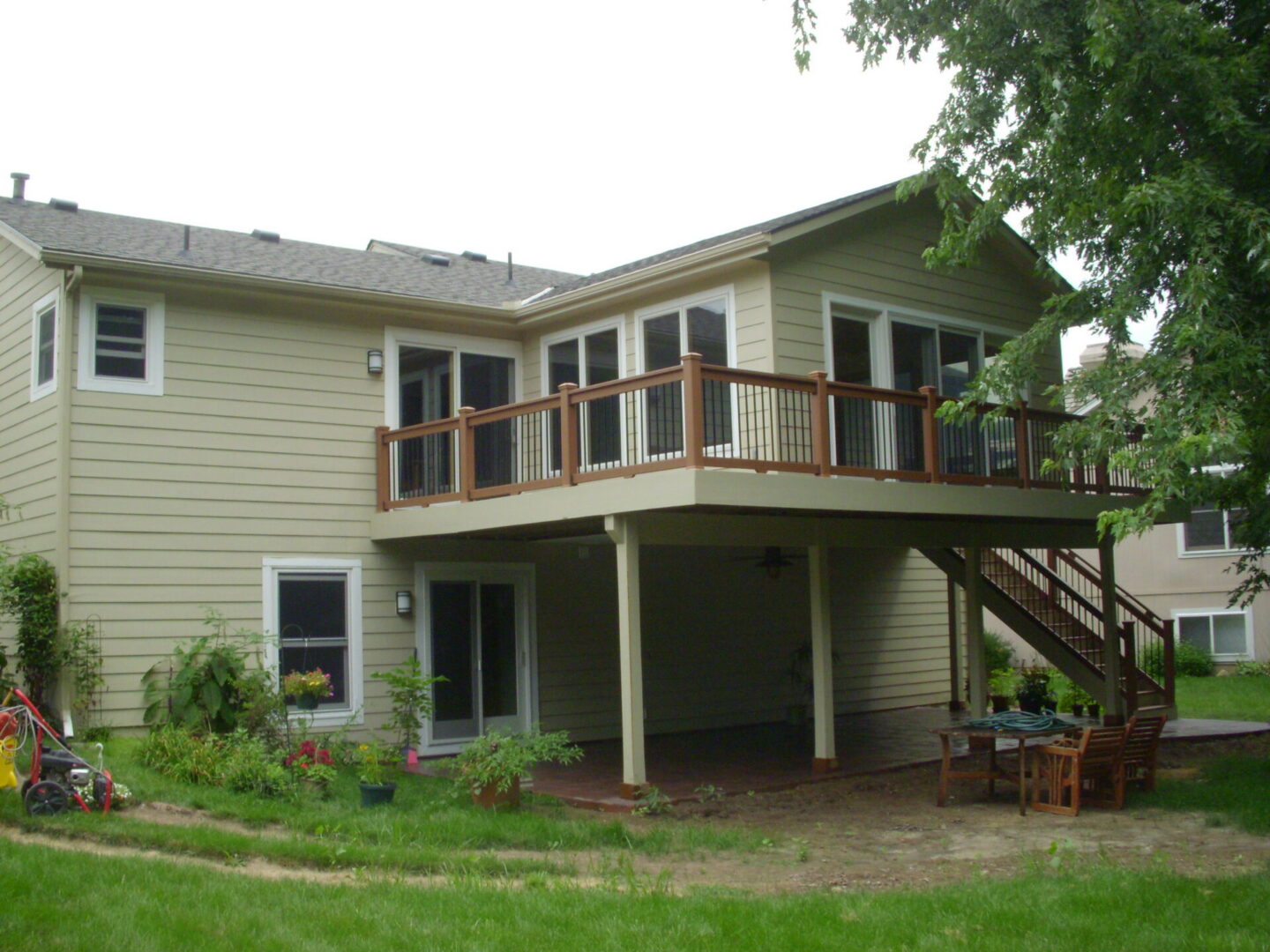 Two-story house with raised wooden deck