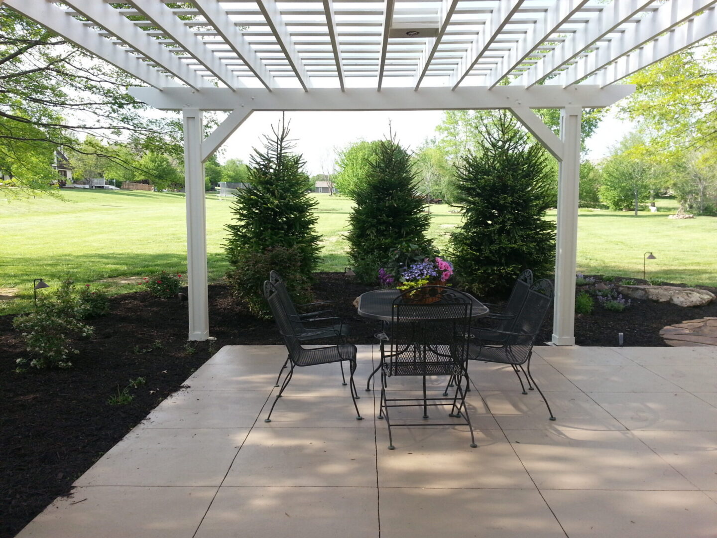 Backyard pergola with outdoor dining set