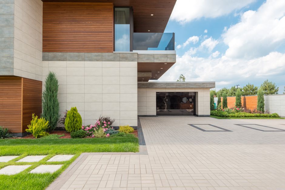 Modern house exterior with driveway and landscaping